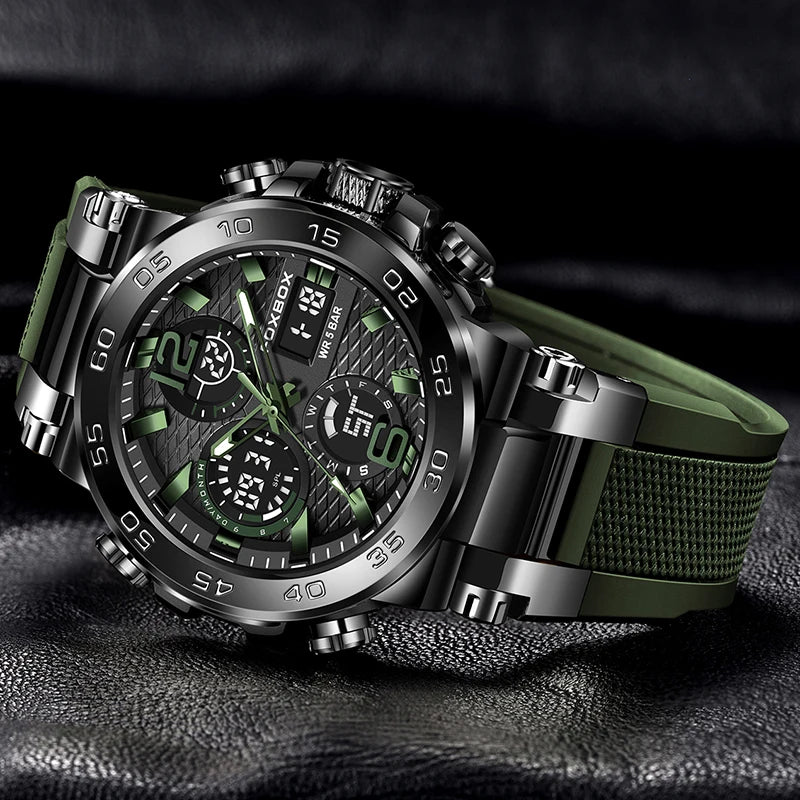 A luxury men's chronograph dive watch with a green strap and silver casing is displayed on a dark surface.