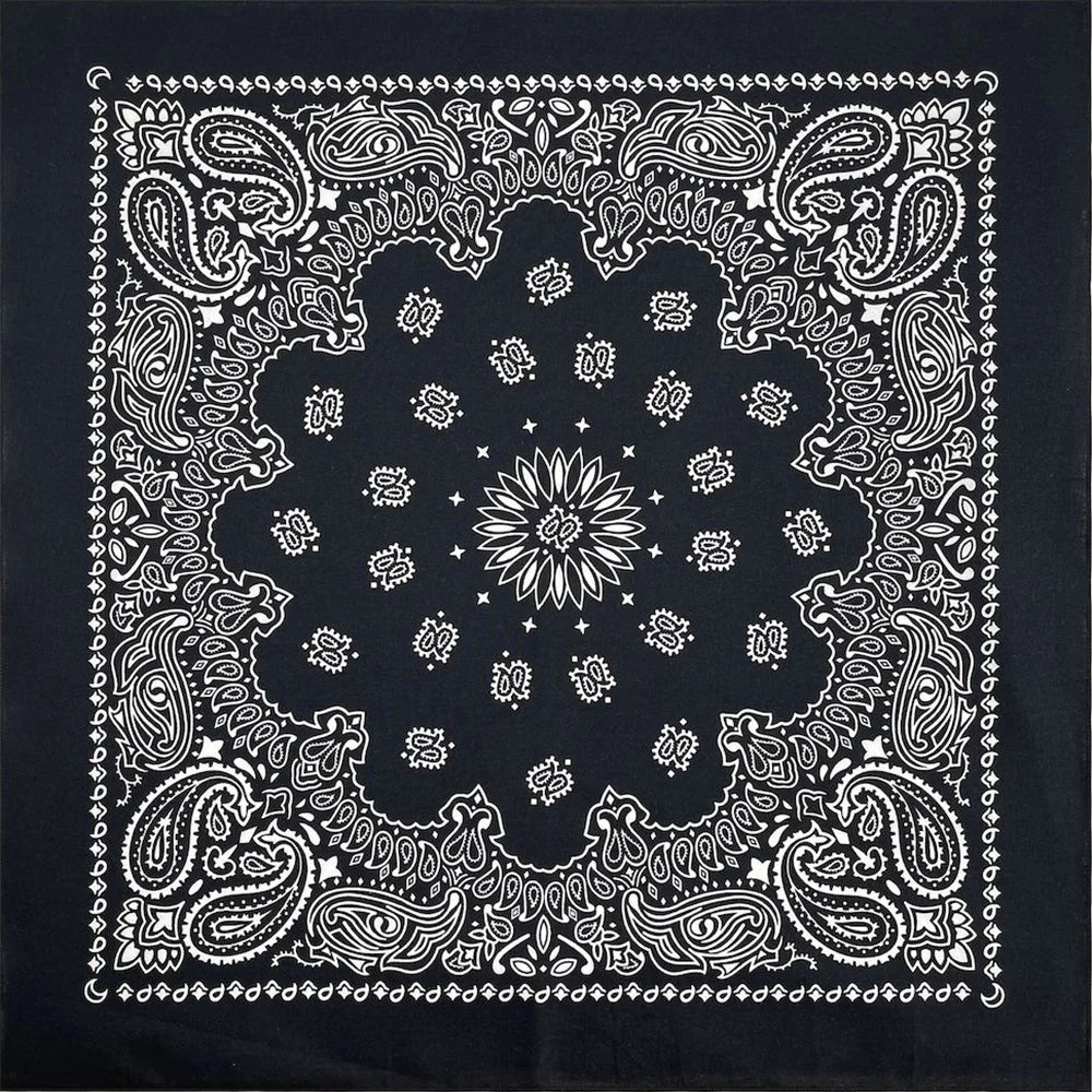 Black fabric with white paisley and floral mandala patterns printed on it.
