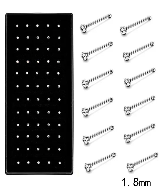 A set of stainless steel nose studs and piercing jewelry with various lengths shown on a black background.