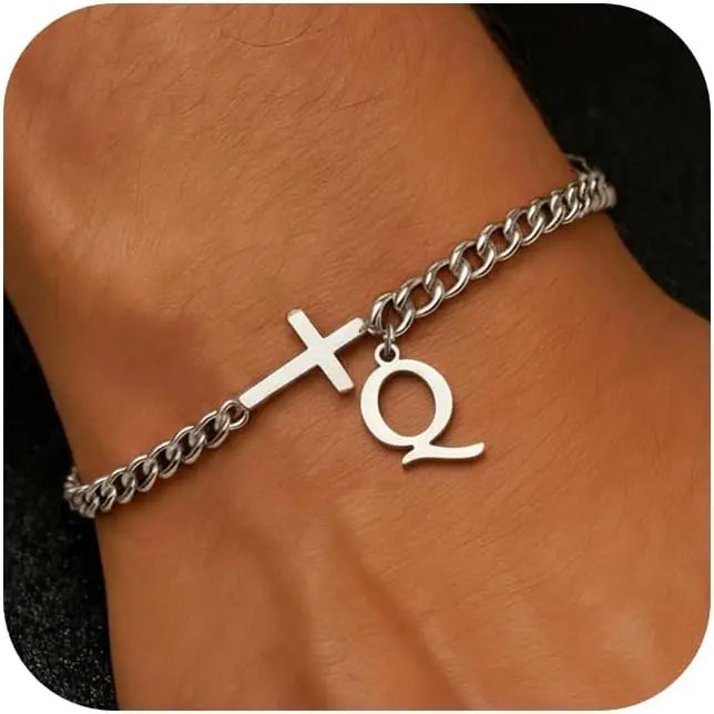 A close-up of a personalized stainless steel cross Cuban chain bracelet worn on a wrist.