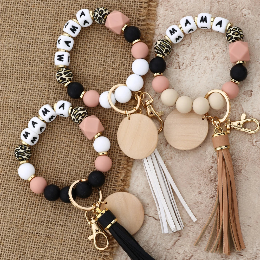 A set of leopard print silicone beads and gold keychains for women