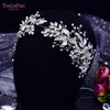 A close-up of a handmade crystal bridal headband displayed on a black mannequin.