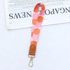 Pinkes und orangefarbenes Leder-Handy-Lanyard mit goldfarbenem Verschluss