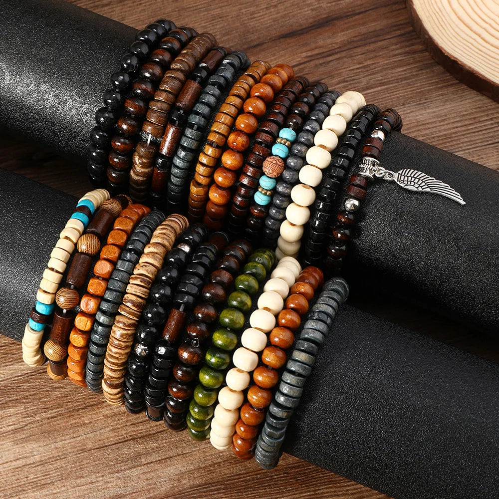 A collection of stacked fashion elastic wood bead bracelets in various shades of brown, black, and natural wood on a dark sur