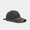 A dark gray washed cotton snapback cap shown from the side.