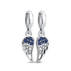 A pair of silver dangle earrings featuring a family tree charm design with blue and white accents.