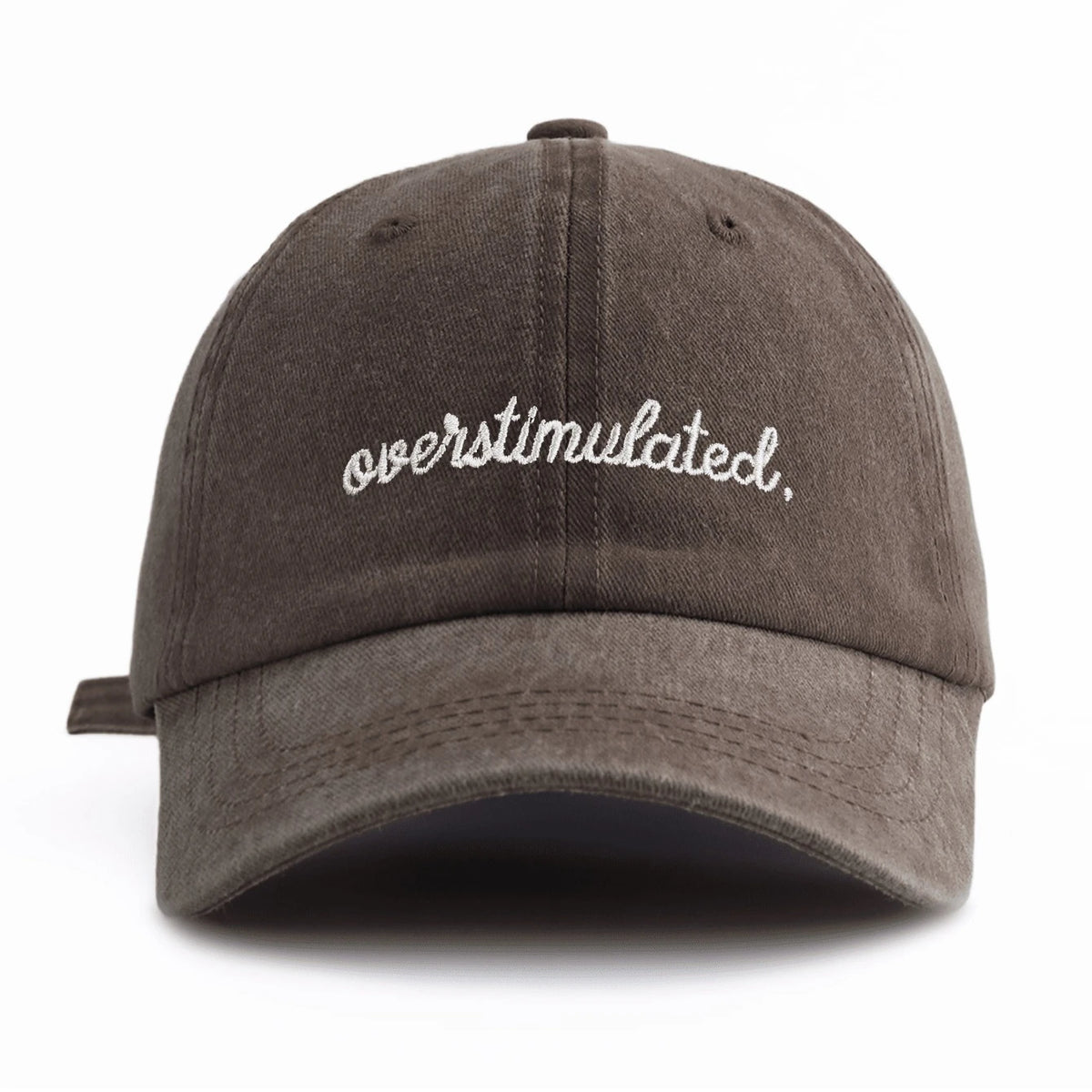 A dark gray baseball cap with white embroidered text that reads overstimulated