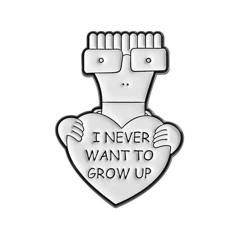 A silver enamel lapel pin shaped like a hand holding a heart, with a face wearing glasses.