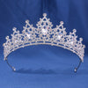 A sparkling crystal rhinestone tiara and headband set with intricate floral designs.