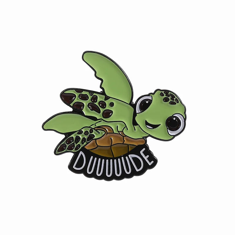 A cute sea turtle enamel lapel pin brooch featuring a green turtle with a black patterned shell and text.