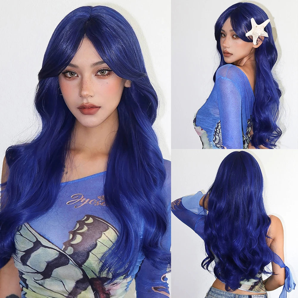 A woman modeling a long blue wavy wig with bangs and a starfish accessory.
