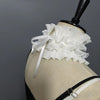 A white pleated ruffle stand collar sweater displayed on a mannequin with a black stand.