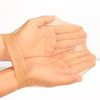 A hand wearing an invisible sheer wig cap for HD wigs, showing the translucent fabric covering the fingers.