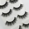 A set of handmade mink strip eyelashes displayed on a white plastic tray.