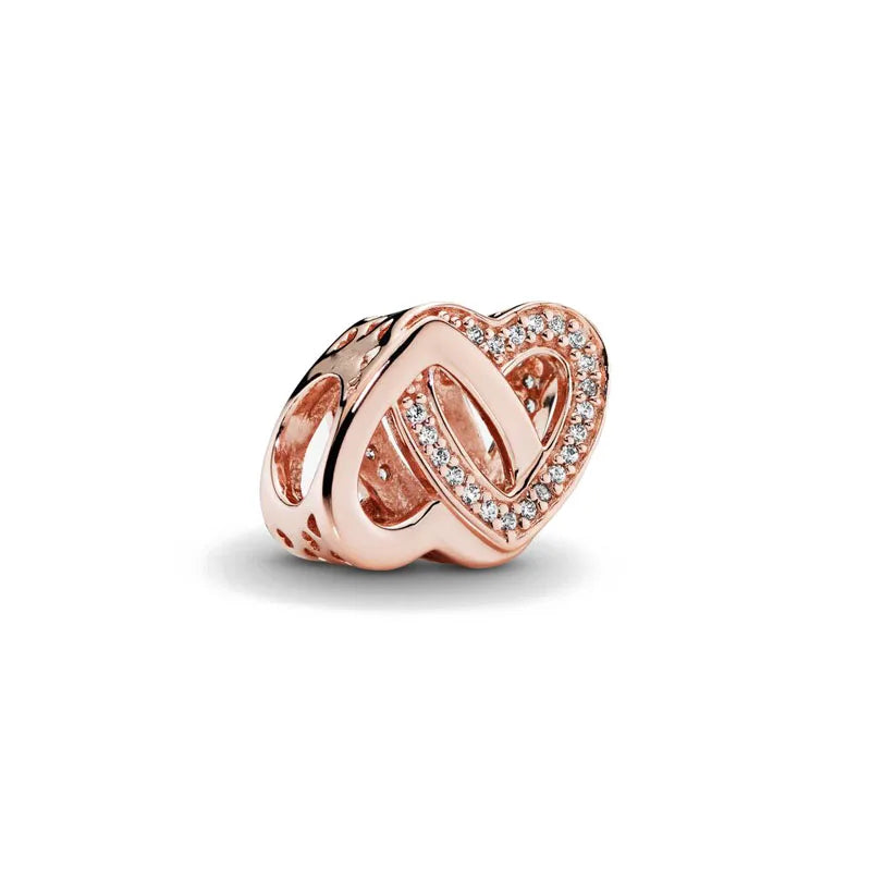 Rose gold diamond heart pendant featuring a cherry blossom design.