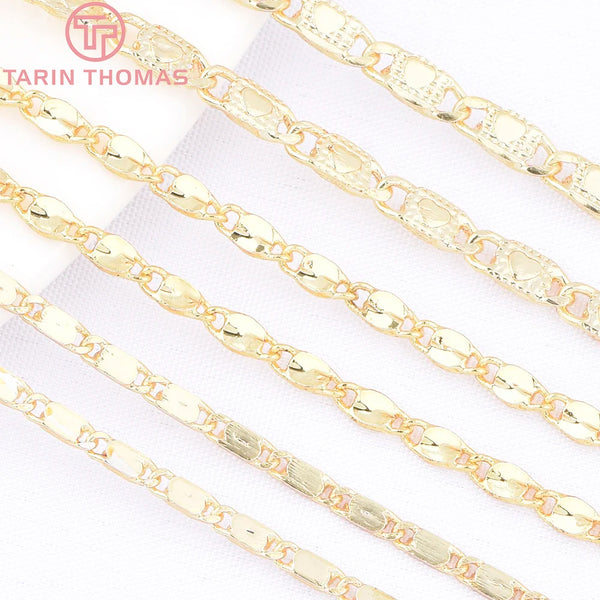 A set of 18K gold heart pendant necklaces and bracelets displayed on white fabric.