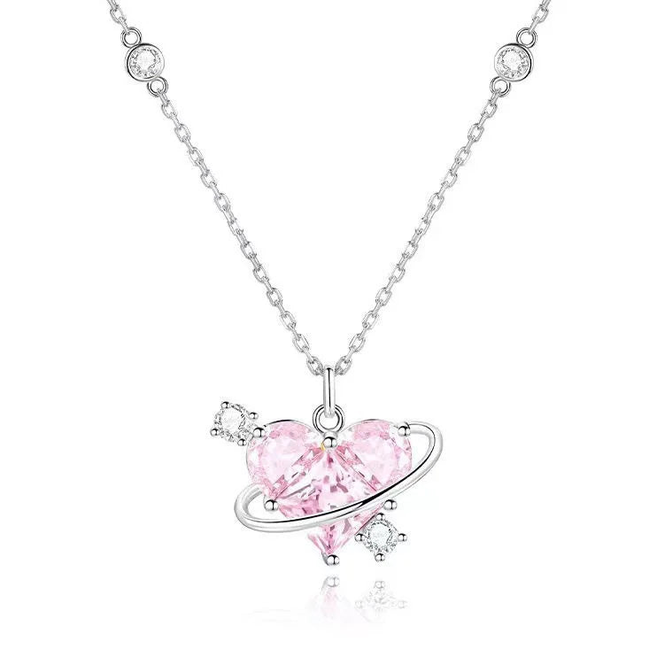 A delicate pink heart necklace featuring zircon stones and a silver chain.
