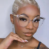 A close-up portrait of a woman wearing vintage metal cat eye anti-blue light eyeglasses.