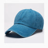 A solid blue washed cotton snapback cap shown from the side.