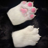 A pair of white paw prints with pink pads on a black background.