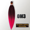 A bundle of long, vibrant pink hair extensions with a gold-colored band and packaging details.