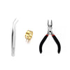 A set of jewelry findings including a silver pin, gold jump rings, and pliers.