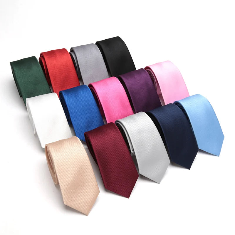A collection of men's slim jacquard business ties in various shades including red, blue, purple, and gray.