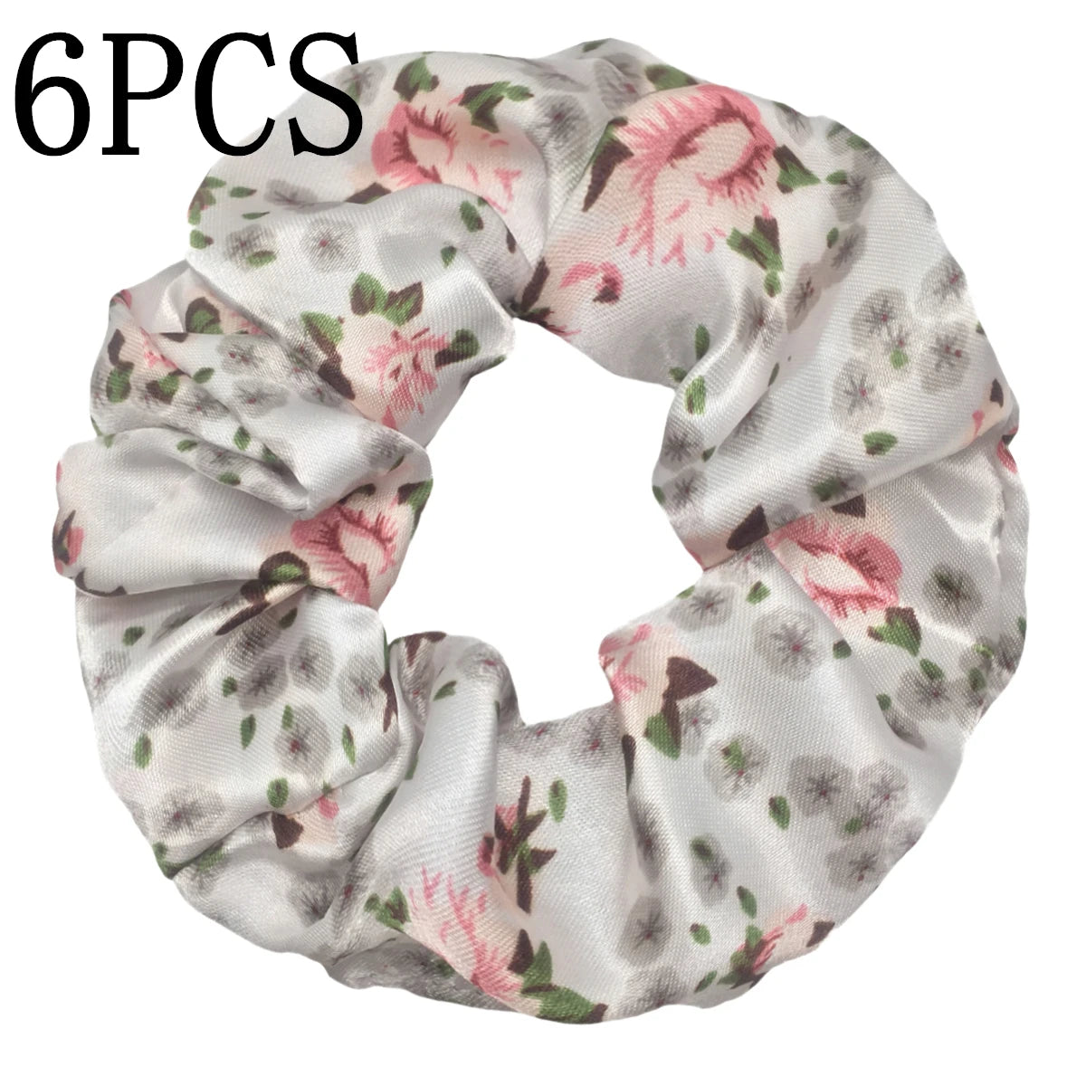 Seis gomas de tela satinada con estampado floral en tonos rosa y verde.