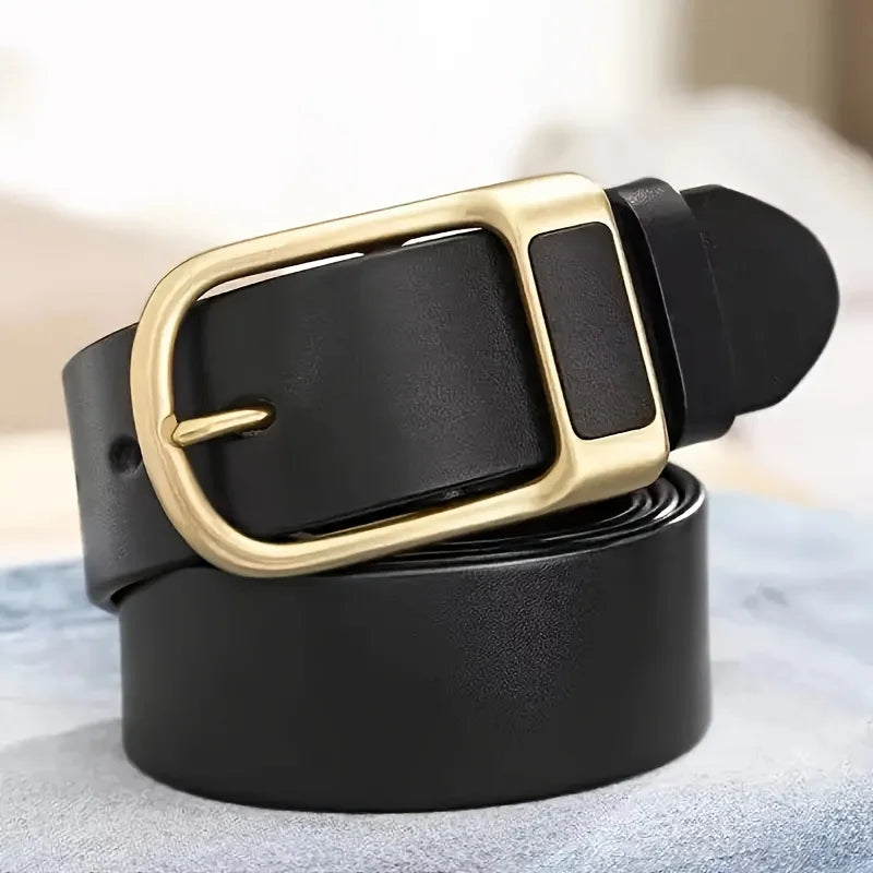 A black men's coboy style PU belt with a gold-toned buckle is shown coiled on a light blue surface.