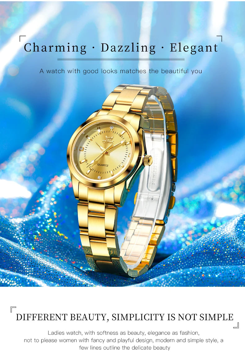 A gold-toned quartz watch with a clear crystal face and silver strap displayed against a blue, sparkling background.