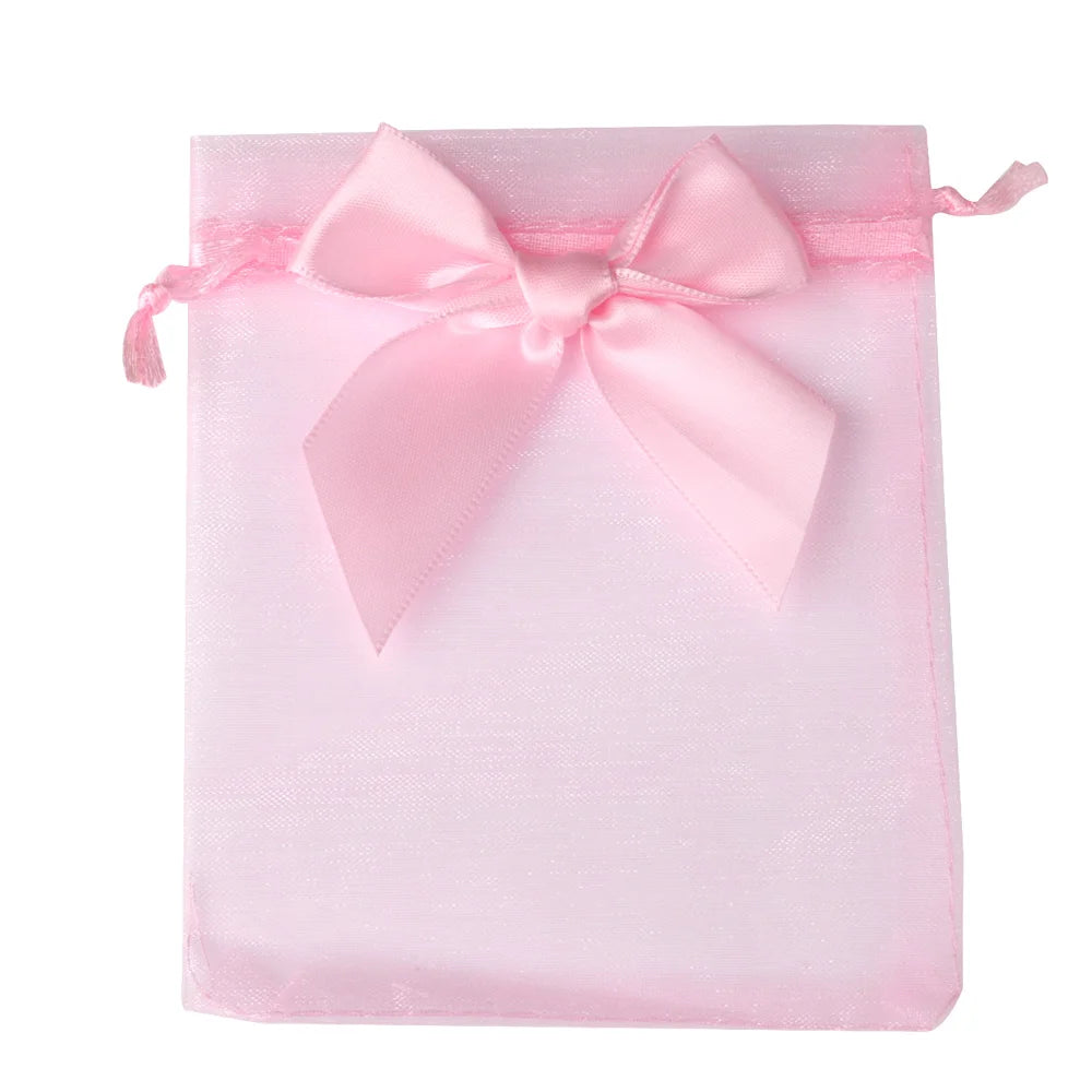 Pink organza drawstring gift bag tied with a satin ribbon