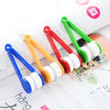 A set of colorful, portable multifunctional eyeglass cleaning tools with rubber tips and plastic handles.