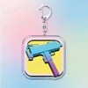 Silver pendant keychain featuring a retro blue and purple paint gun design on a yellow background