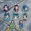 A collection of cute anime character brooches and lapel pins featuring various characters with purple, blue, and green hair a