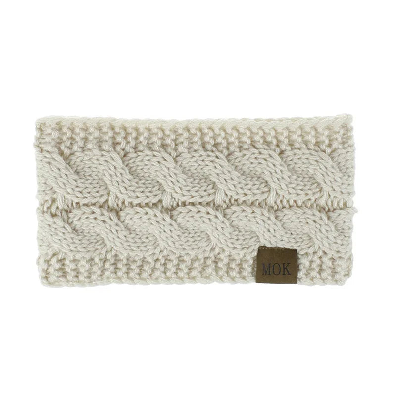 A cream-colored knitted plush winter ear warmer headband.