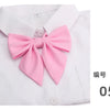 White shirt with a pink butterfly ribbon tie set on the collar
