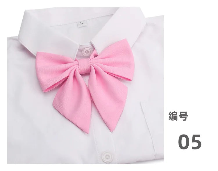 White shirt with a pink butterfly ribbon tie set on the collar