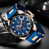 A blue and rose gold men's luxury quartz sport watch with a chronograph displayed on a dark surface.