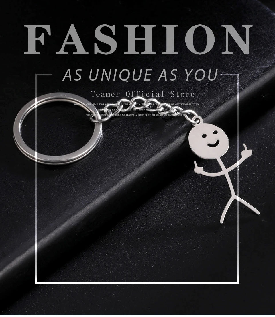 Silver keychain featuring a stickman making a middle finger gesture against a black background.
