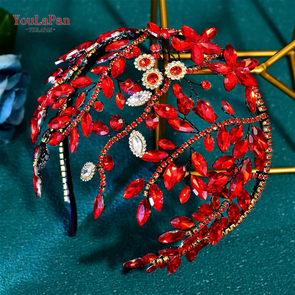 A detailed arrangement of sparkling red and clear rhinestones forming a bridal hair hoop design.