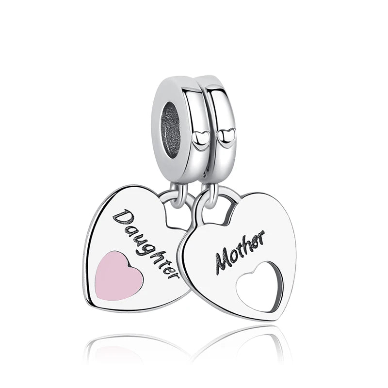 A pair of silver heart-shaped charms engraved with Daughter and Mother