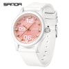 A white classic quartz fashion watch with a pink dial and silver accents on a white silicone strap.