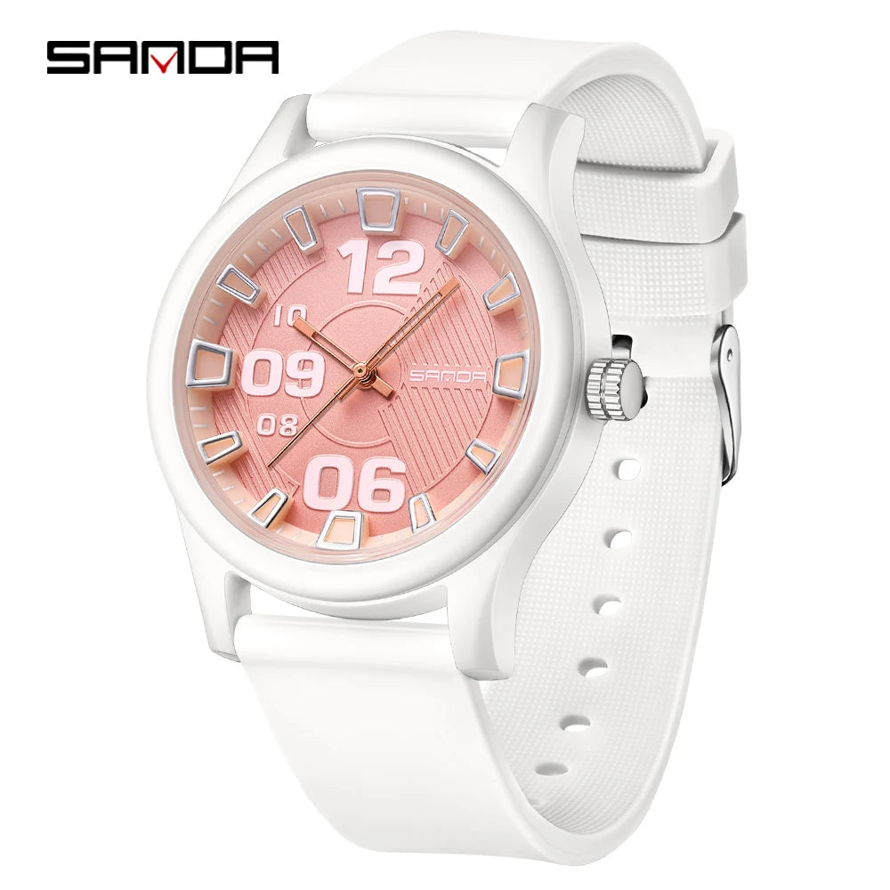 A white classic quartz fashion watch with a pink dial and silver accents on a white silicone strap.