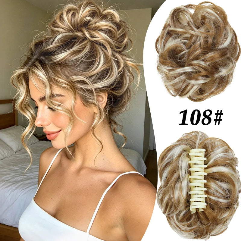A woman shows off a voluminous curly messy bun hairstyle with blonde highlights and a matching claw clip accessory.