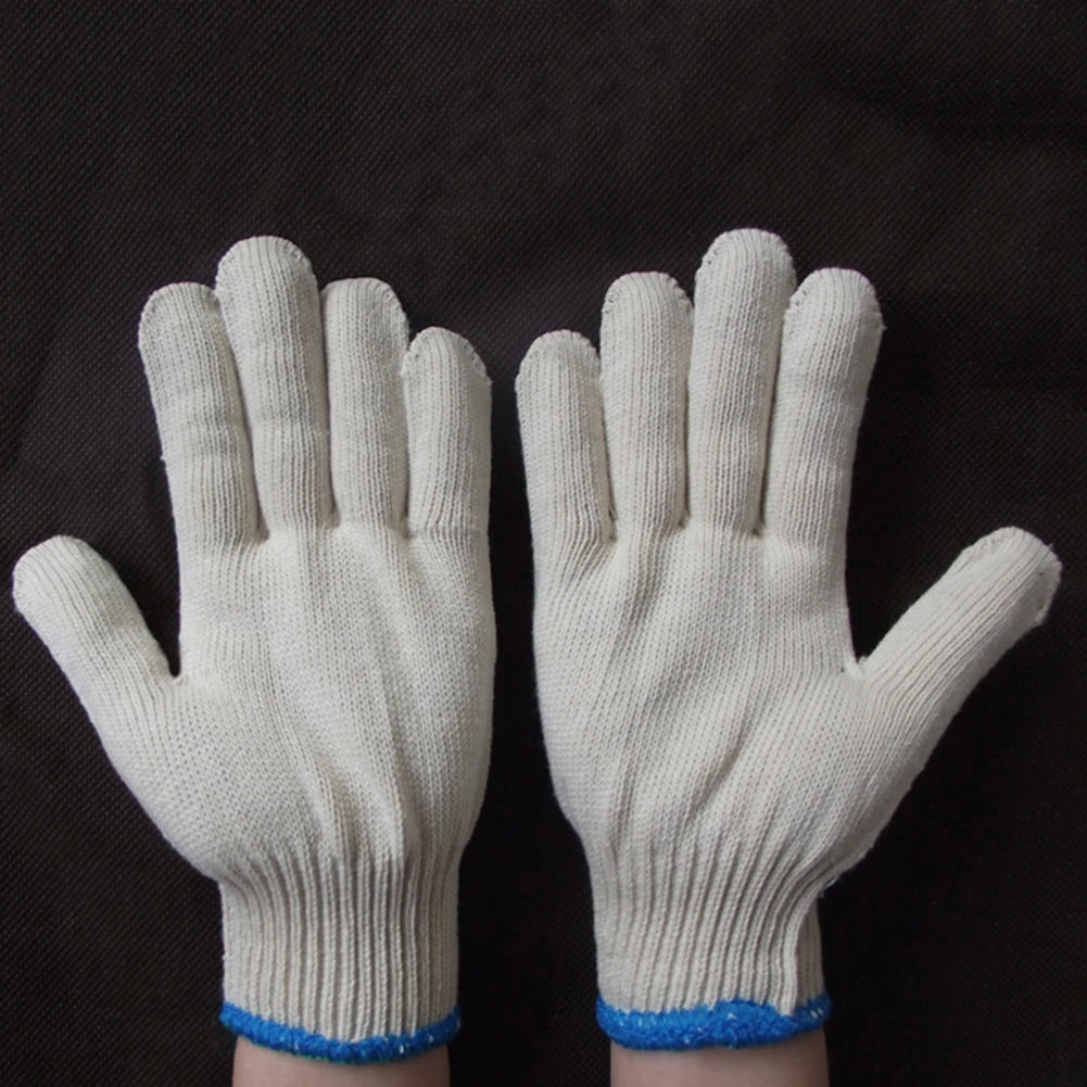 Pair of white cotton thread work gloves with blue trim shown against a dark background.