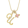 Gold letter pendant necklace featuring a cursive initial and a pink gemstone charm