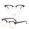 Gafas con marco de oro negro, mostradas desde la vista frontal y lateral.