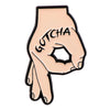 A light pink enamel pin featuring a hand gesture with the word GOTCHA written on the palm.