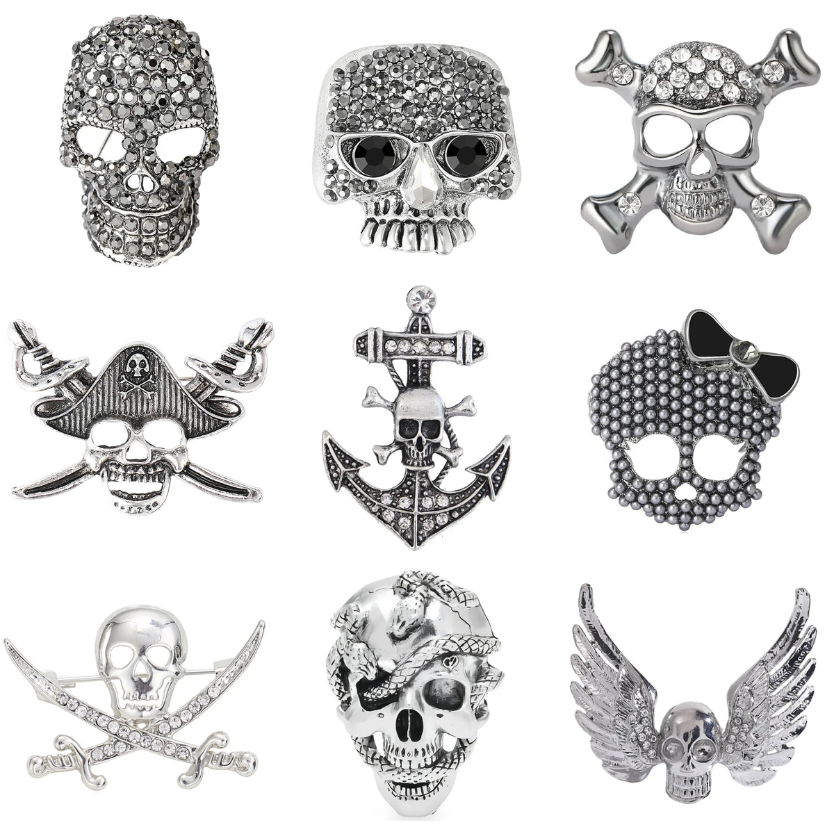 Colección de broches con calaveras de plata y pedrería, incluyendo calaveras, anclas y alas.