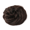 A dark brown messy bun hairstyle for curly updos.